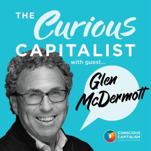 The Curious Capitalist podcast cover with Glen McDermott. Glen is a white man wearing glasses